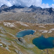 Crystal clear lakes on the descent of Monte Taou Blanc